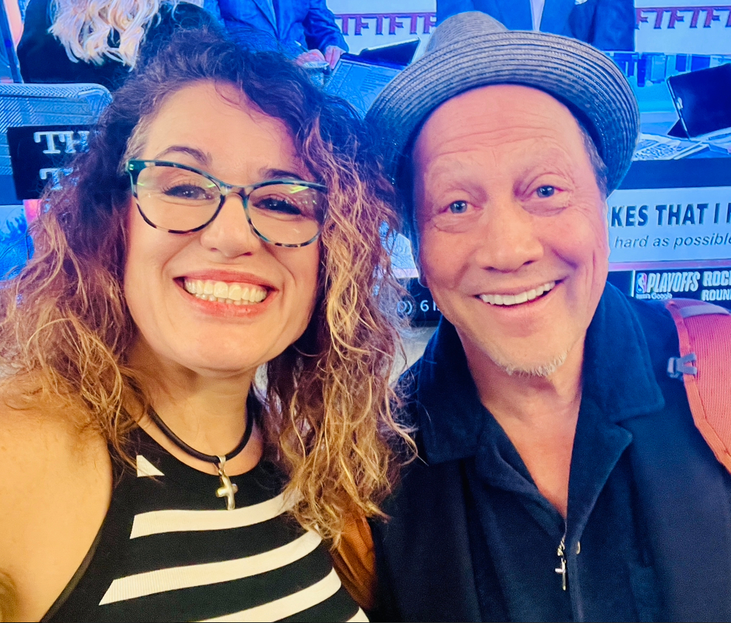 Artist Shen Hallford posing with actor and comedian Rob Schneider during a chance airport meeting in Charleston