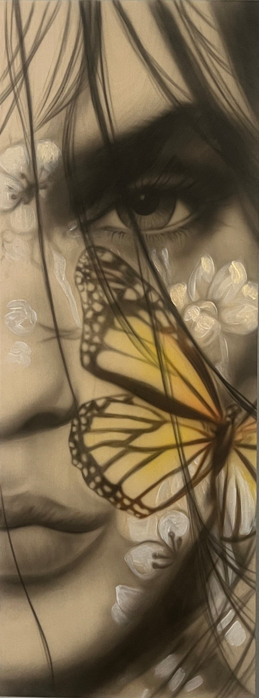 A mixed media painting on wood featuring a girl with a butterfly interwoven in sepia tones, with floral accents in the background.