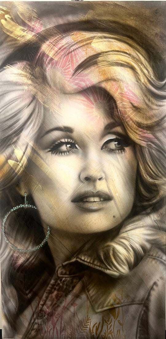 A mixed media painting on wood featuring a portrait of Dolly Parton with a blurred background.