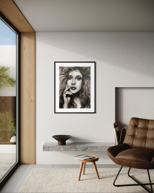 Modern living room with a brown chair, small table, and abstract painting on a white wall. Stevie Nicks by ShenShen limited edition reproduction paper fine art print.
