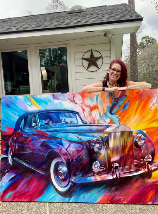 ShenShen standing outside with her big bold vibrant luxurious 48"x72" "Timeless Elegance" "which pays homage to the iconic 1959 Rolls Royce
