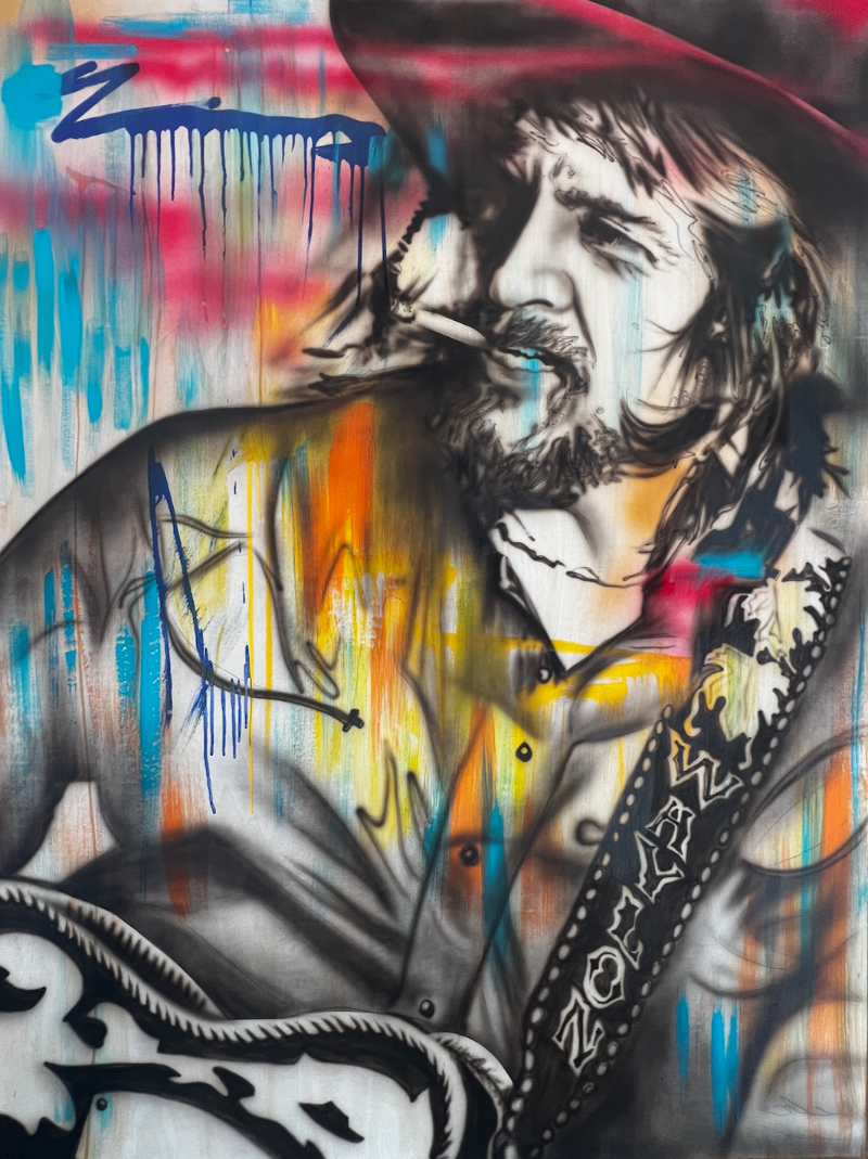Waylon in color is an original painting by ShenShen of Waylon Jennings smoking a cigarette while holding a guitar lots of blues pinks oranges  and yellow hues