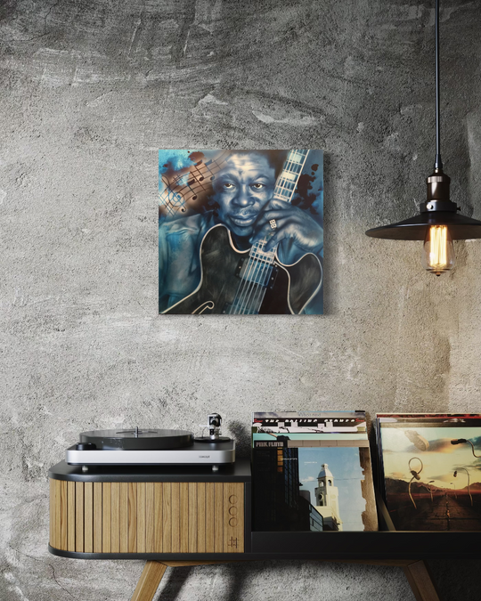 Canvas print of a musician with a guitar on a wall above a record player and records. BB King Blues fine art reproduction limited edition canvas giclee print by shenshen.