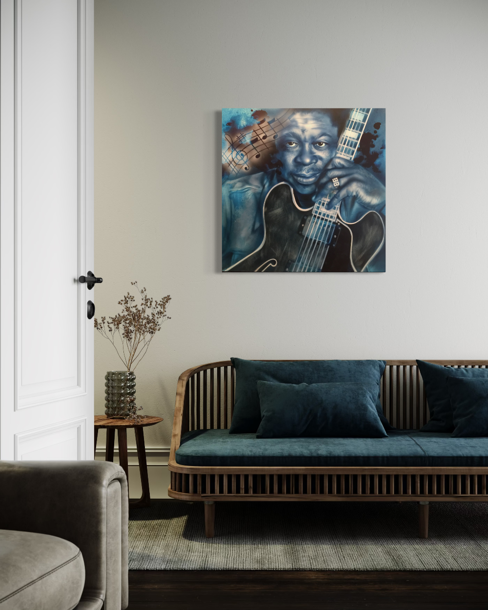 Living room with a blue couch, decorative plant, and wall art of a person holding a guitar. BB King Blues fine art reproduction limited edition canvas giclee print by shenshen.