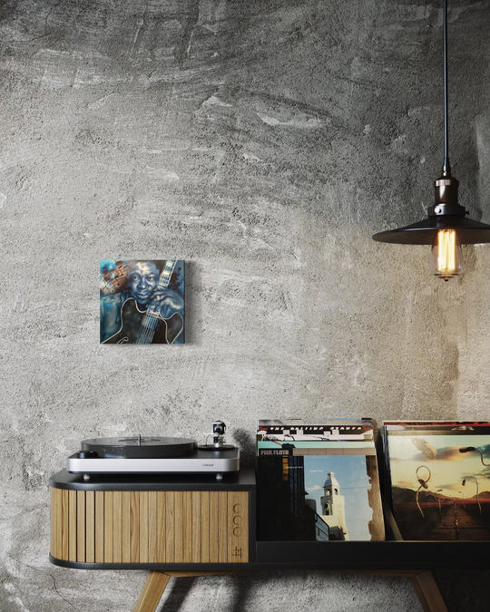 Record player with vinyl records against a textured wall. BB King Blues fine art reproduction limited edition canvas giclee print by shenshen.