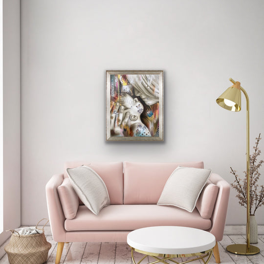 Beautiful life art print displayed in a fun modern living room above a pink couch.
