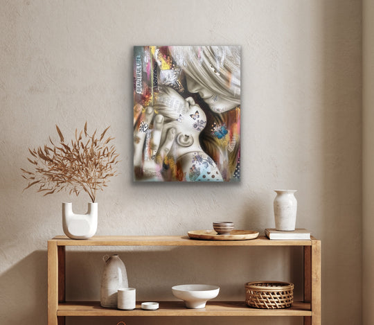 Abstract painting on a wall above a wooden console table with decorative items.