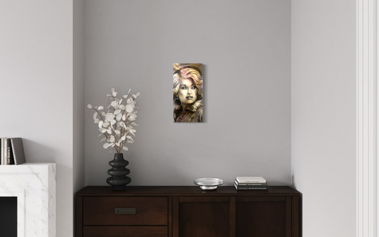Wall art of a woman's face on a gray wall above a wooden console table. canvas giclee reproduction of iridescent dolly parton by shenshen