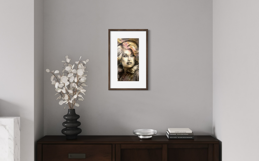 Framed artwork on a gray wall above a wooden console table with decorative items.
