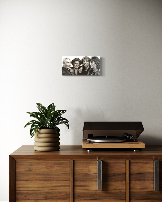 Wooden cabinet with a plant and record player, wall art above. Rolling Stones by ShenShen limited reproduction canvas giclee fine art print.
