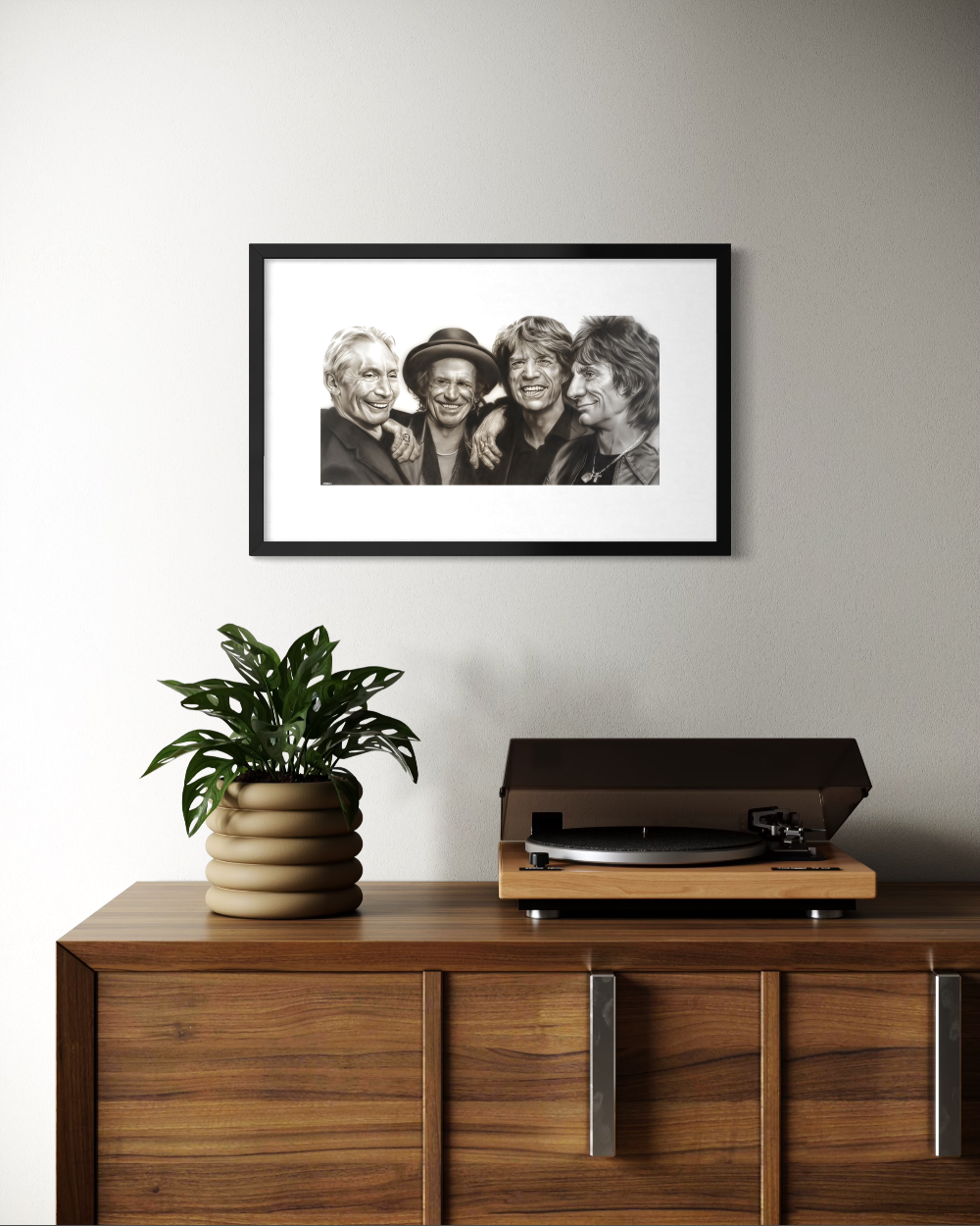 Framed black and white photo above a wooden cabinet with a plant and record player. Rolling Stones by ShenShen limited reproduction paper fine art print.