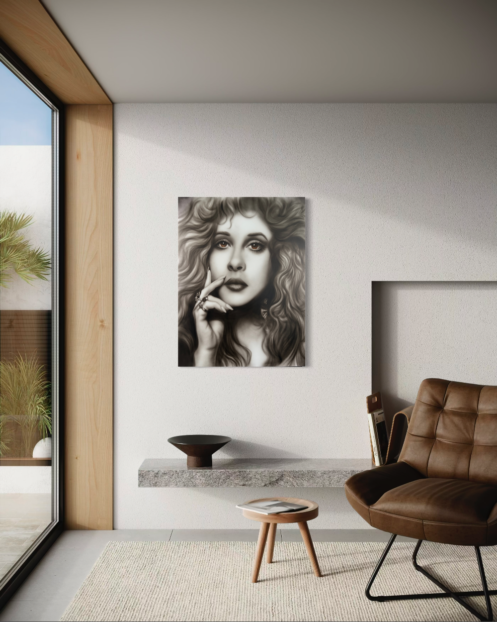 Modern living room with a portrait of a woman on the wall, a brown leather chair, and a small wooden table. Stevie Nicks by ShenShen limited edition reproduction canvas giclee fine art print.