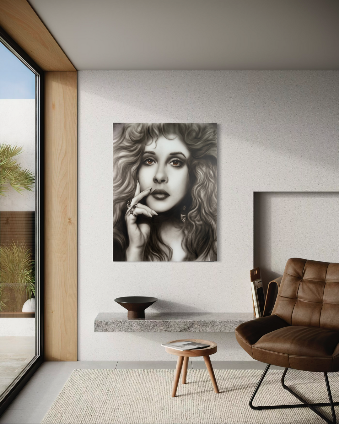 Modern interior with a woman's portrait on the wall, brown chair, and small table. Stevie Nicks by ShenShen limited edition reproduction canvas giclee fine art print.