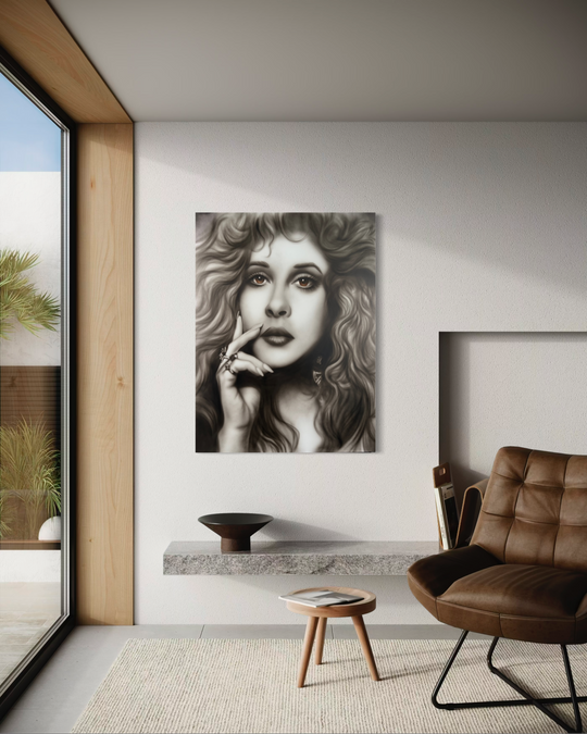 Modern interior with a woman's portrait on the wall, brown chair, and small table. Stevie Nicks by ShenShen limited edition reproduction canvas giclee fine art print.