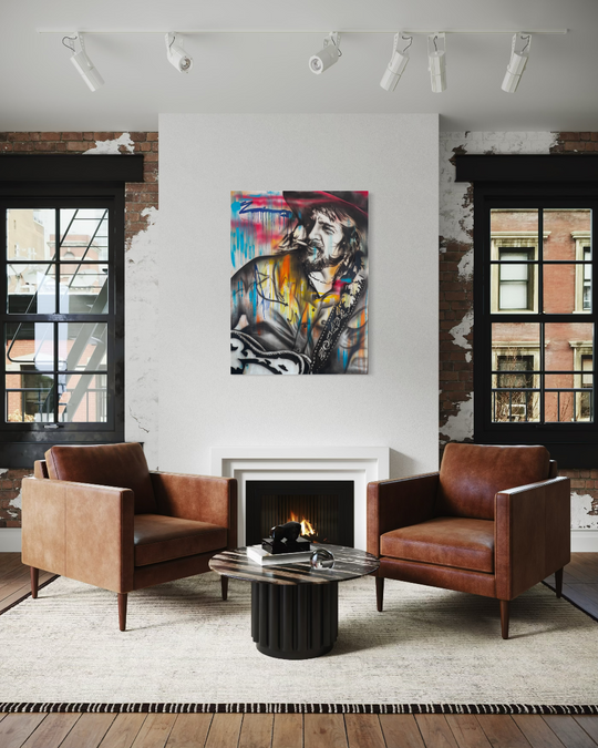 Modern living room with brown leather chairs, a coffee table, and a colorful painting on the wall. Waylon Jennings limited edition reproduction fine art print by ShenShen.