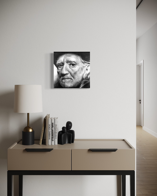 Modern interior with a beige console table, lamp, books, and decorative items against a white wall with a framed portrait. Willie Nelson limited edition reproduction fine art print by ShenShen.