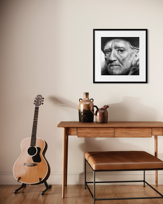 Guitar on a stand, wooden table with vases, and framed portrait on a wall. Willie Nelson limited edition reproduction fine art print by ShenShen.