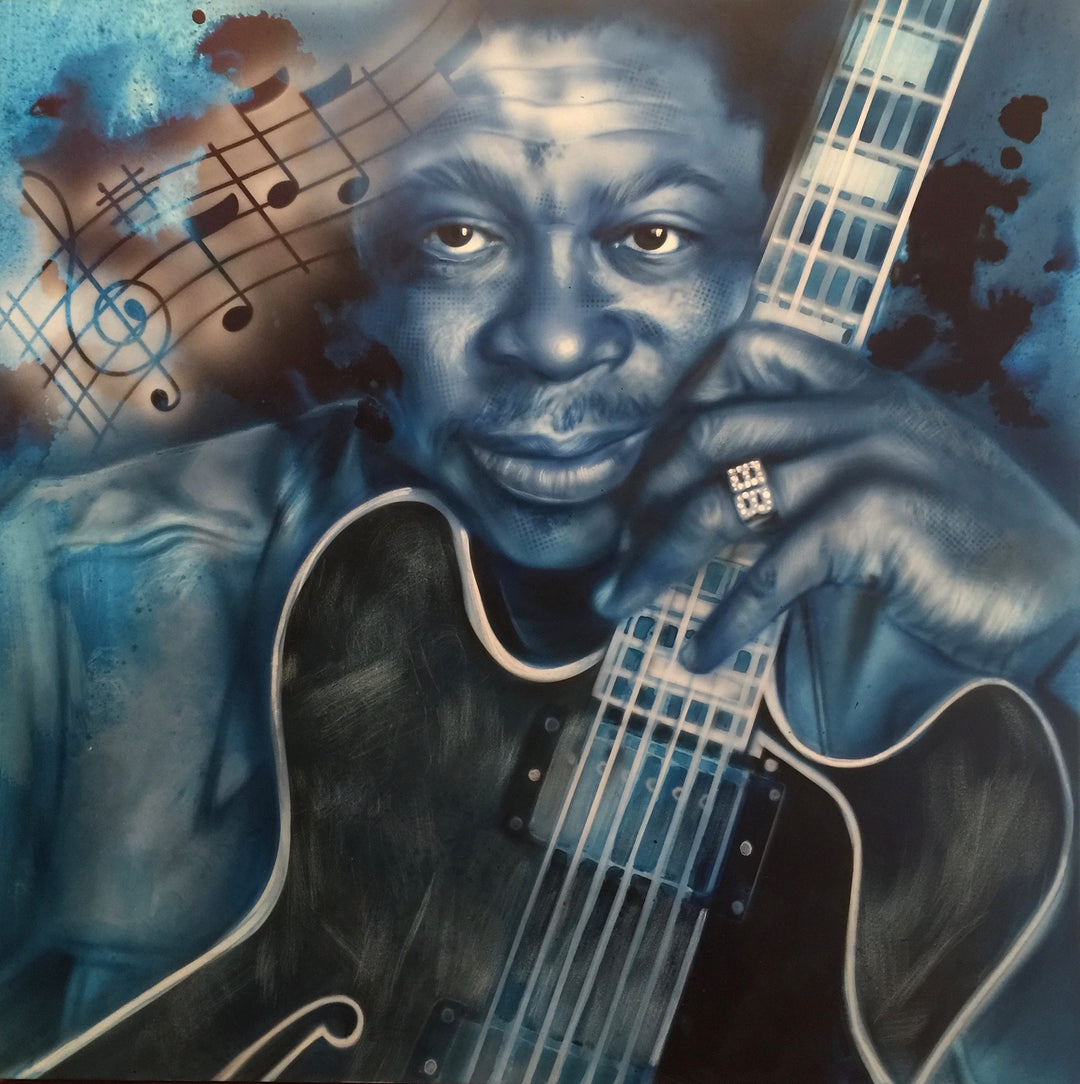 A painted portrait of BB King with a guitar, set against a blue background with musical notes.
