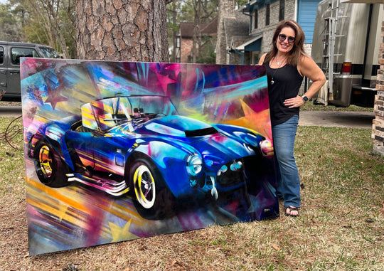 A vibrant mixed media painting on wood featuring a blue Shelby Cobra with a high-gloss resin finish.